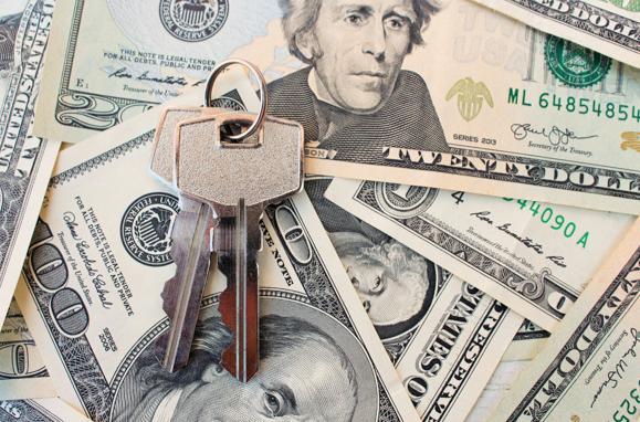 House keys on top of money