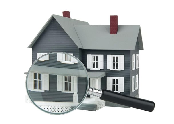 Home under magnifying glass