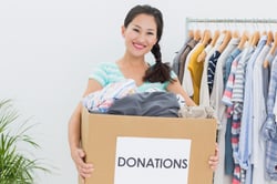 Portrait of a young woman with clothes donation.jpeg