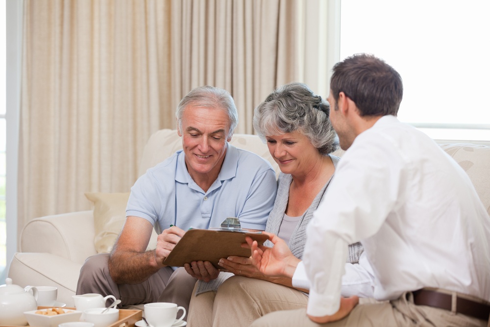 Seniors with assurance man at home